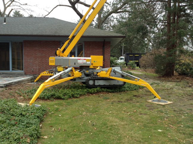OMME Lift – 52 foot side reach and 90 foot work working height with 360 degree rotation. Compact ½ feet wide for back yard access. Rubber tracks instead of wheels for less impact on lawns.